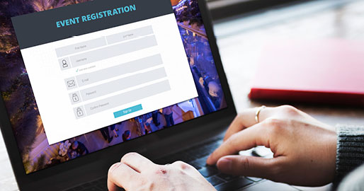 Event attendee using the event registration website on a laptop computer